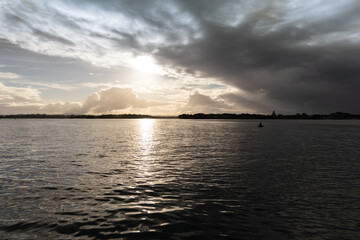 Fototapeta na wymiar Shimmering lake in dusk, before sunset 