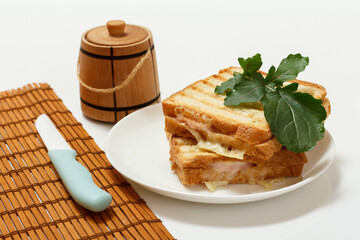 Homemade grilled cheese sandwich for breakfast on plate.