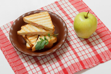 Homemade grilled cheese sandwich for breakfast on plate.