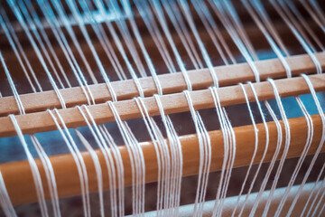  close up of weaving machine. A loom machine for clothing or woven label. Weaving machine for...