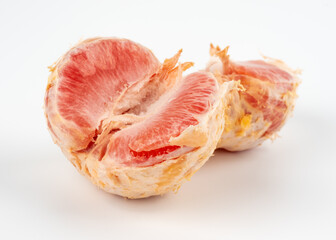 Red grapefruit on a white background. 
