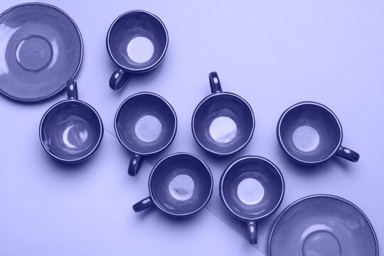 Set of clean dishes and cups in lilac color.