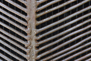 Old metal. Rusty grill. Radiator grille.