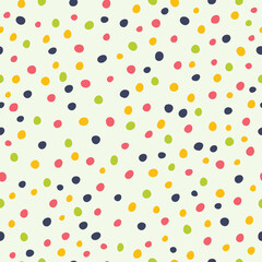 Simple polka dot background. Seamless pattern. Drawn with dry brush and colored ink.