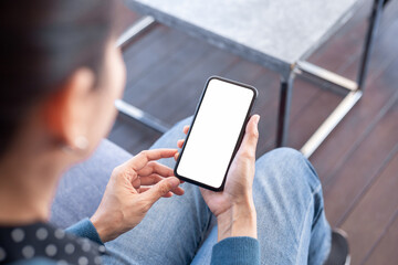 cell phone blank white screen mockup.hand holding texting using mobile on desk at office.background empty space for advertise.work people contact marketing business,technology
