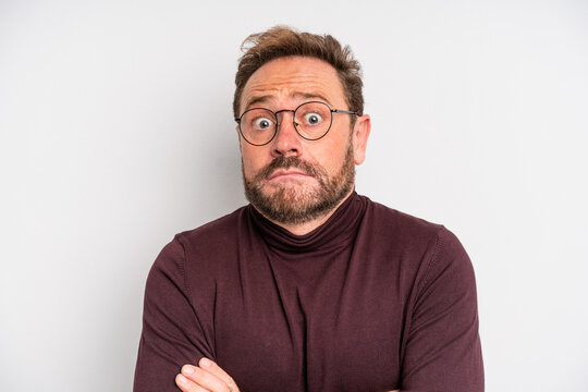 middle age man shrugging, feeling confused and uncertain