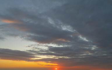 Sunset sky. Abstract nature background. Dramatic blue with orange colorful clouds in twilight time.