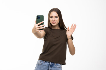 Fototapeta premium Happy young woman blogger influencer holding modern smart phone wave hand hello.