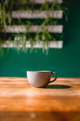 Coffee cup with cream or milk, top view on beautiful wooden background. Great picture for baner or menu