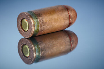 8 mm old pistol cartridge with ball copper bullet. Close up.