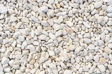 Textured background of white pebbles for outdoor decoration.
