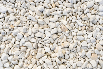 Textured background of white pebbles for outdoor decoration.