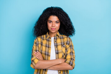 Photo of self-assured freelancer lady crossed hands look camera wear checkered shirt isolated blue color background