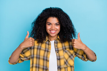 Photo of reliable lady raise thumb-up positive feedback rate wear plaid shirt isolated blue color background