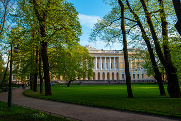 Russia. Petersburg. Russian Museum. City park with green grass and trees near famous State Russian Museum (Mikhailovsky Palace).