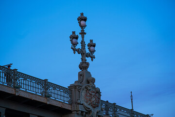 Fototapeta premium Detail of a bridge in Saint-Petersburg on a blue sky background. Architecture element. Saint Petersburg, Russia.