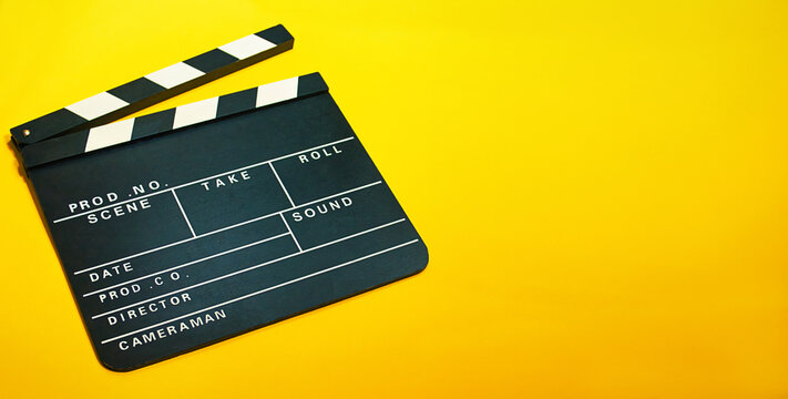 A clapperboard, symbol of filmmaking and video production. Professional type of equipment, used on films to assist in synchronizing of picture and sound