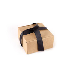 One craft boxes with black bow and ribbon isolated on white background