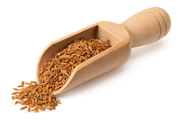 Roasted cumin seeds in the wooden spoon, isolated on white background