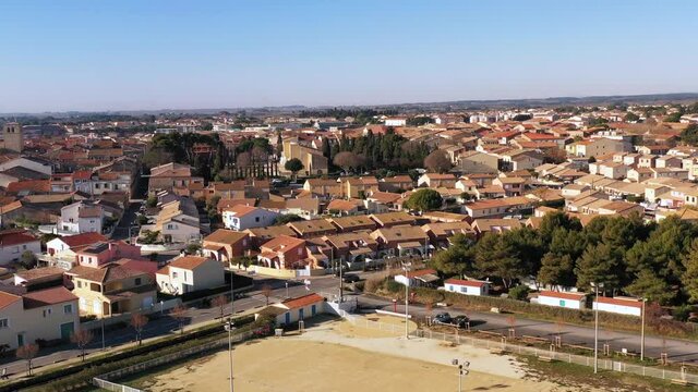 Aerial view of the village of Mèze, on a winter morning, in Herault in Occitanie, France
