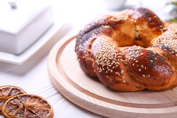 Russian national bread Kalach on a white wooden background