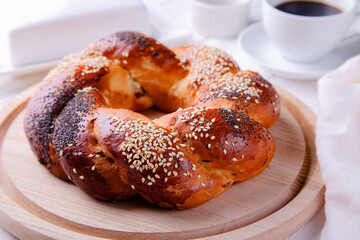 Russian national bread Kalach on a white wooden background