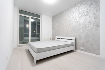 bed in an empty room. Patient room and insurance concept.