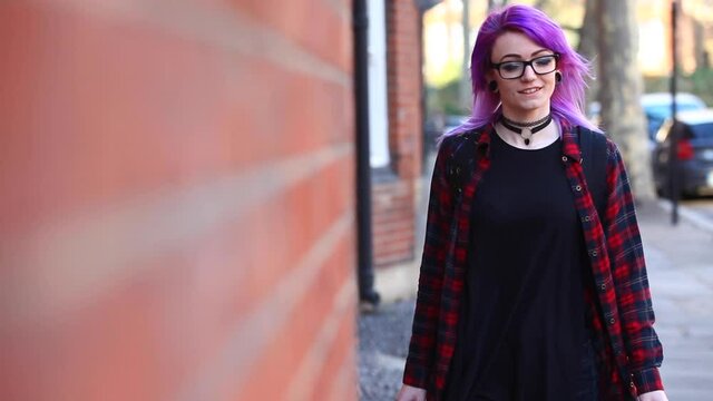 Alternative young woman in London walking and having fun in the city