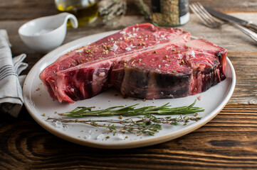 Dry aged t-bone steak with salt and pepper