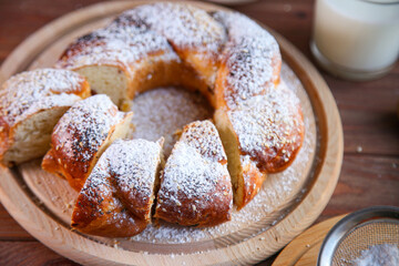 Russian national bread Kalach on a wooden background