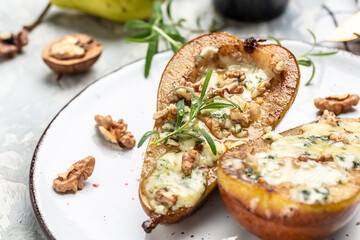 Pears baked with blue cheese, nuts, honey. Food recipe background. Close up