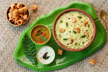 Ven Pongal Khara Pongal with Sambar coconut Chutney popular Indian breakfast food Tamil Nadu festival Pongal Sankranti Diwali spicy pongal prepared with rice lentil semolina rava South India Sri Lanka