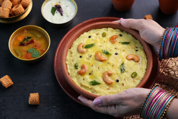 Ven Pongal Khara Pongal Sambar coconut chutney woman hand serving Indian breakfast food Tamil Nadu...