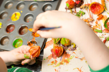 Making colored palm. Bouquet of dried bends and flowers. An Easter palm is a traditional Polish and Lithuanian symbolic decoration associated with Palm Sunday.