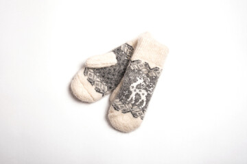 Winter warm fluffy wool mittens on a white background.