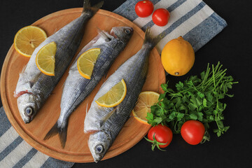Freshly Caught Bogue Fish Or Boops Boops fish ready to be cooked on wooden cutting board : Turkish name Kupes fish