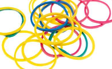 Multi-colored rubber bands isolated on white background.