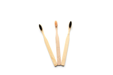 Eco-friendly bamboo toothbrushes on white background. Flat lay, top view, copy space