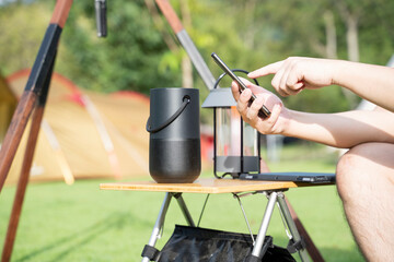 Men using a Smart speaker with smartphone.