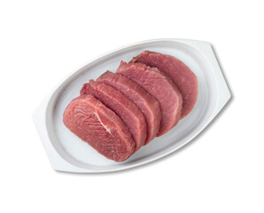 Cut raw eye round meat over white plate with seasonings isolated over white background