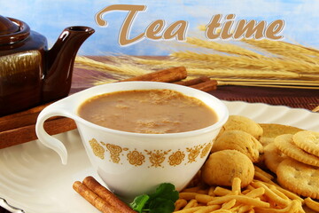 tea cup with tea time text and traditional homemade indian gujarati tea time snack food