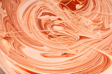 Mixing of red and white water-based paint.