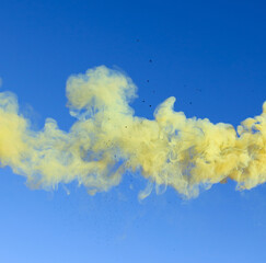 Yellow smoke on a blue background.