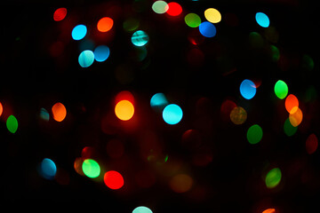 Colorful bokeh abstract background. Glittering stars on dark background. Lights. Garland. Background