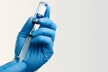 Doctor with syringe and vial of the vaccine for new Covid-19 Omicron