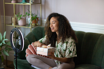 Social influencer filming unboxing for social media