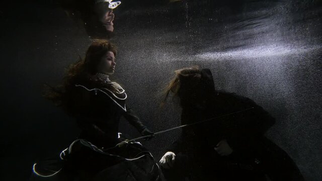scene from medieval Europe underwater, magic and fairytale concept, queen is knighting man