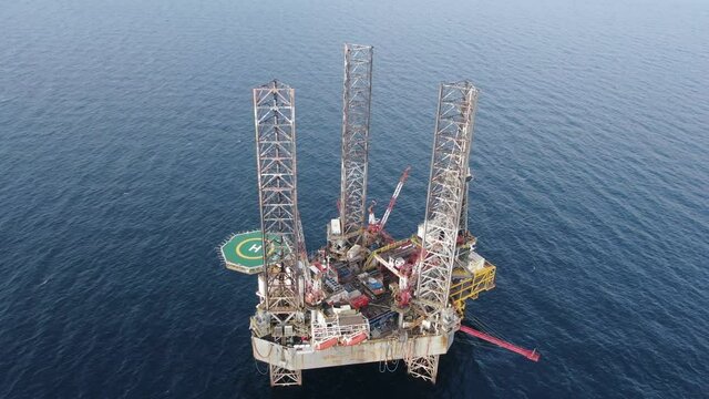 Aerial view maintenance repair of the jack up oil and gas rig up in the shipyard, Offshore oil and Gas processing platform, oil and gas industry.