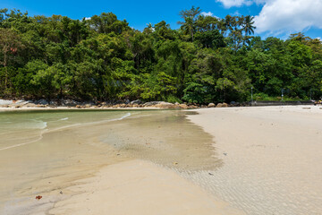 Kata beach in Phuket, Thailand, beach with clear water, white and golden sand, blue sky, in tropical vacation area.  a beach holiday  photo with copyspace.