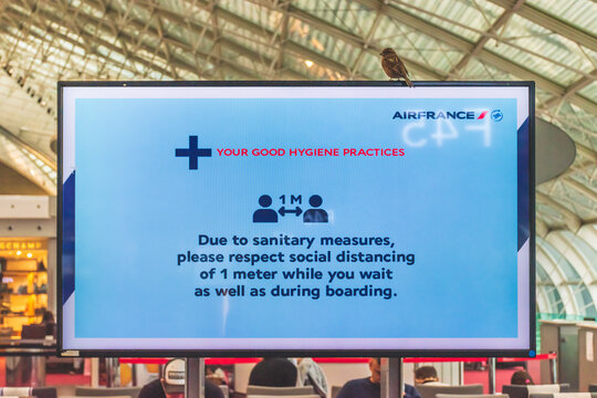 Paris, France - January 12, 2021: A message on social distancing as shown in the Paris Charles de Gaulle airport (CDG)